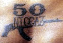 “50 Niggaz” tattoo